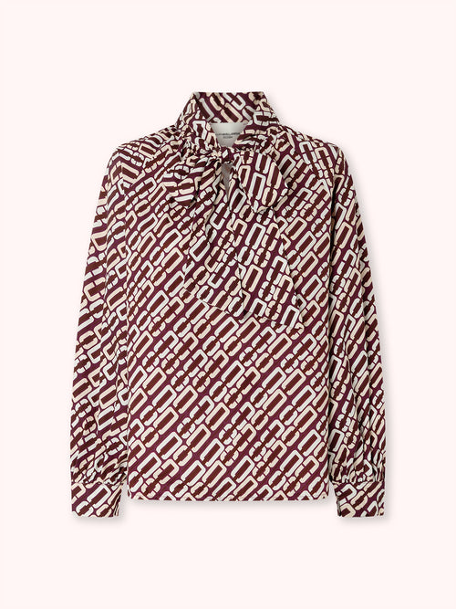 BLUSA MANGA ABULLONADA CON ESTAMPADO BURDEOS