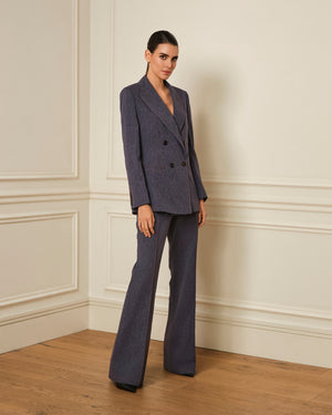 PANTALÓN FLARE CON COSTURAS VISTAS DENIM JASPEADO